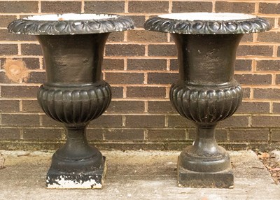 Lot 780 - A pair of black painted cast iron campana urns,...