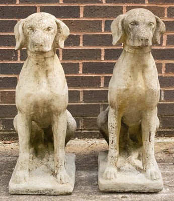 Lot 787 - A pair of composition stone figures of seated...