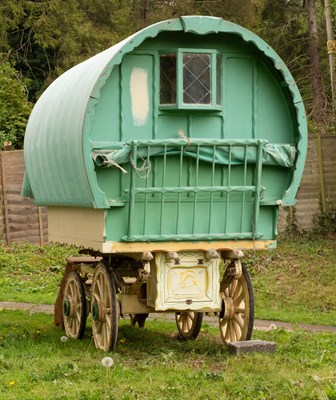 Lot 788 - A child's gypsy bow-top caravan with a canvas...