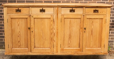 Lot 818 - A pine cupboard enclosed by a pair of panel...