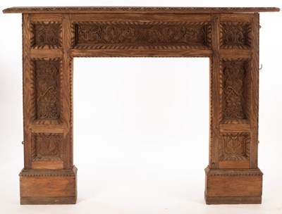 Lot 820 - A carved oak fire surround set panels of...