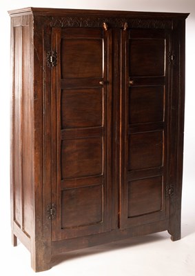 Lot 828 - An oak two-door Jacobean style wardrobe with...