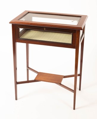 Lot 829 - An Edwardian mahogany display table, on square...