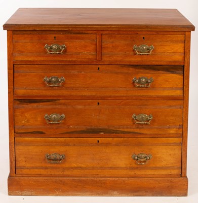 Lot 830 - An Edwardian walnut chest of three long and...