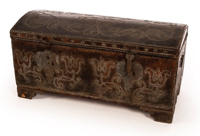 Lot 843 - A leather covered trunk with studded scrolls...