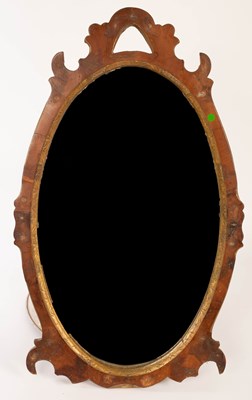 Lot 846 - An oval mahogany wall mirror with carved...