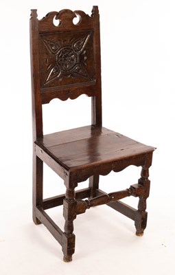 Lot 870 - A 17th Century style oak chair with carved...