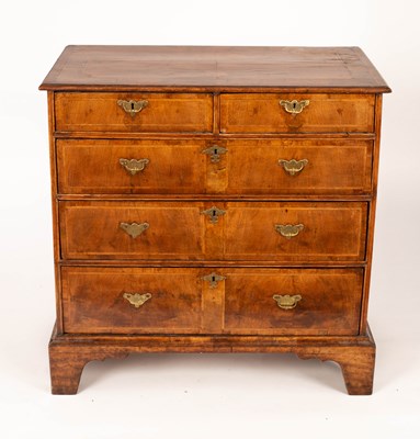 Lot 879 - An 18th Century walnut chest of three long and...