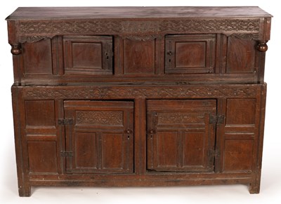 Lot 883 - An English oak press cupboard, the overhanging...