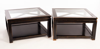 Lot 891 - A pair of ebonised coffee tables with inset...