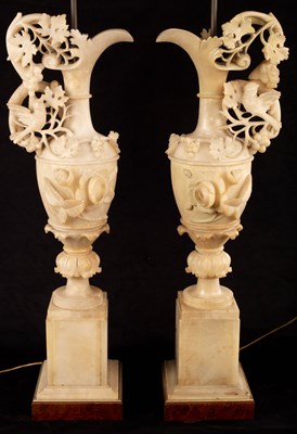 Lot 925 - A pair of Italian alabaster ewer-shaped lamps,...