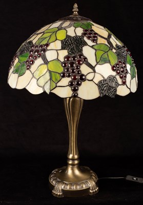 Lot 928 - A Tiffany type table lamp, the shade of cream...