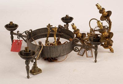 Lot 930 - A wrought iron four-light electrolier with...