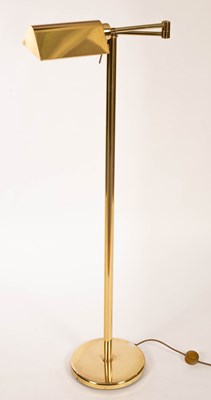 Lot 933 - An adjustable brass reading lamp, 125cm high