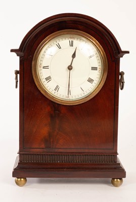 Lot 950 - An Edwardian mahogany arch-top mantel clock on...