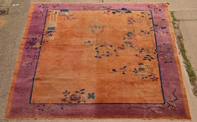 Lot 975 - A Chinese Art Deco style carpet, the purple...