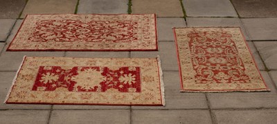 Lot 985 - Three modern Pakistani rugs, the largest 147cm...