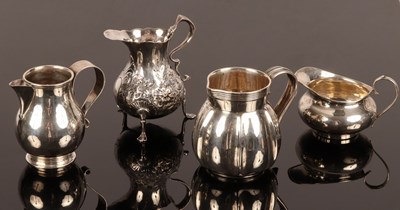 Lot 9 - Four silver jugs, including one of baluster...