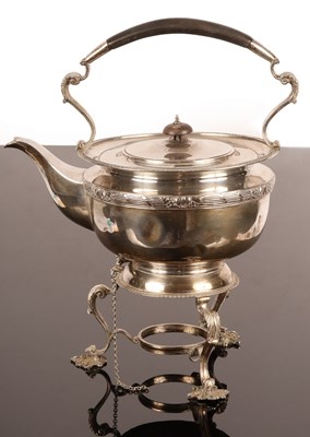 Lot 24 - A circular silver tea kettle and stand, London...