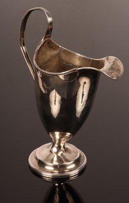 Lot 39 - A George III helmet-shaped silver cream jug,...