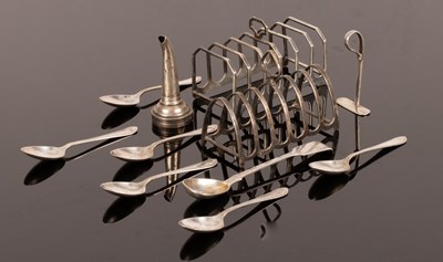Lot 45 - Two silver toast racks, six feather edged...
