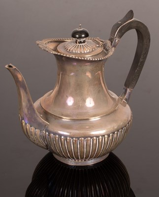 Lot 54 - A late Victorian silver hot water jug, London...