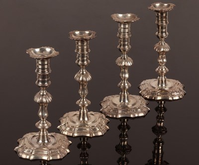 Lot 66 - A matched set of four George II cast silver...