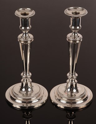 Lot 67 - A pair of George III silver candlesticks,...