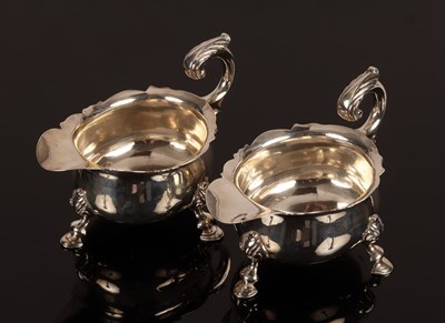 Lot 72 - A pair of George II style silver sauce boats,...