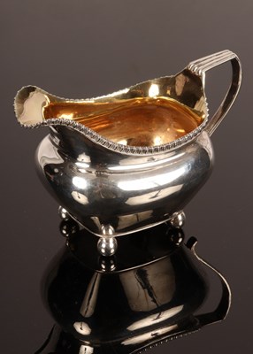Lot 78 - A George III silver and silver gilt cream jug,...