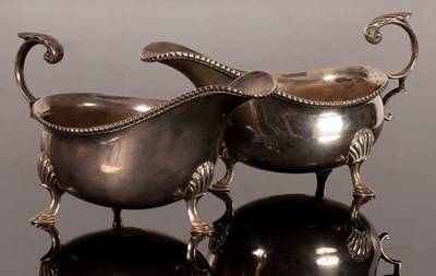 Lot 127 - A pair of 18th Century style silver sauce...