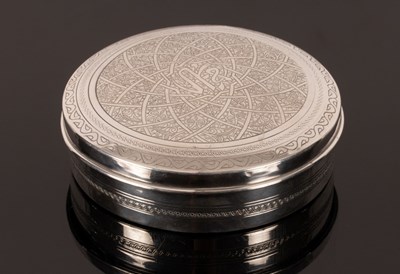 Lot 168 - An Egyptian silver circular box with engraved...