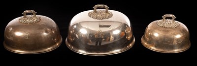 Lot 187 - A set of three silver plated food domes, each...