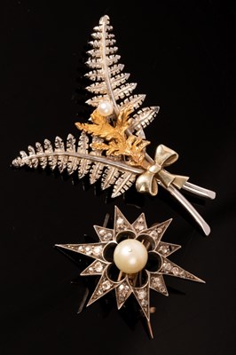 Lot 217 - A Victorian diamond and pearl starburst brooch,...