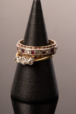 Lot 237 - A diamond three-stone ring, set in 18ct gold...