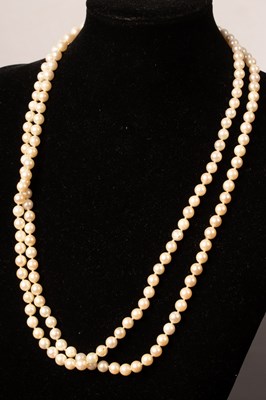 Lot 242 - A two-row cultured pearl necklace with gold...