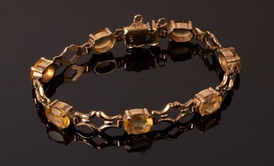 Lot 256 - A gem set bracelet by Cropp & Farr, set in 9ct...