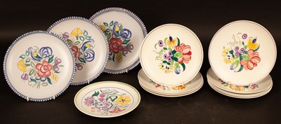 Lot 307 - Poole Pottery, three floral decorated plates,...