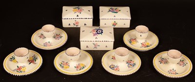 Lot 311 - Poole Pottery, six floral decorated egg cups...