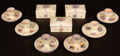 Lot 312 - Poole Pottery, six floral decorated egg cups...