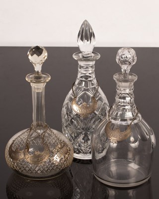 Lot 363 - Three cut glass decanters with three plated...