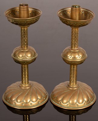 Lot 372 - A pair of copper and brass candlesticks with...