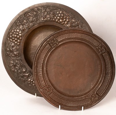 Lot 378 - A copper charger with hammered centre and...