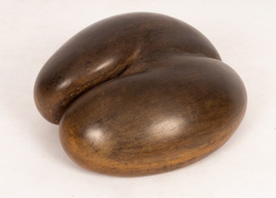 Lot 424 - A polished Coco de Mer, 32cm x 28cm