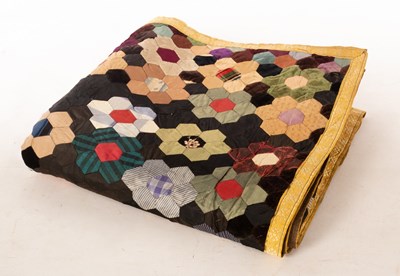 Lot 444 - A Victorian patchwork quilt, finely decorated...