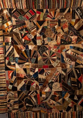 Lot 447 - A late 19th Century American patchwork quilt...