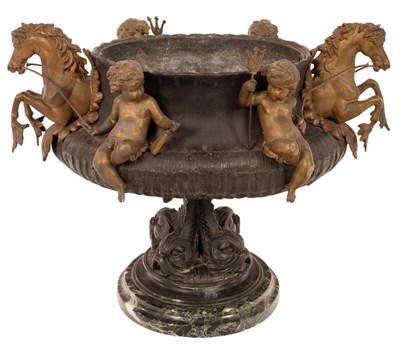 Lot 483 - A metal jardinière with applied cherubs and...