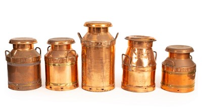 Lot 505 - Five milk churns and covers, the largest 67cm...