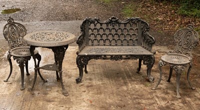 Lot 508 - A cast iron suite of garden furniture...