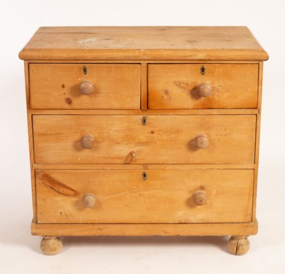 Lot 515 - A pine chest of drawers fitted two short over...